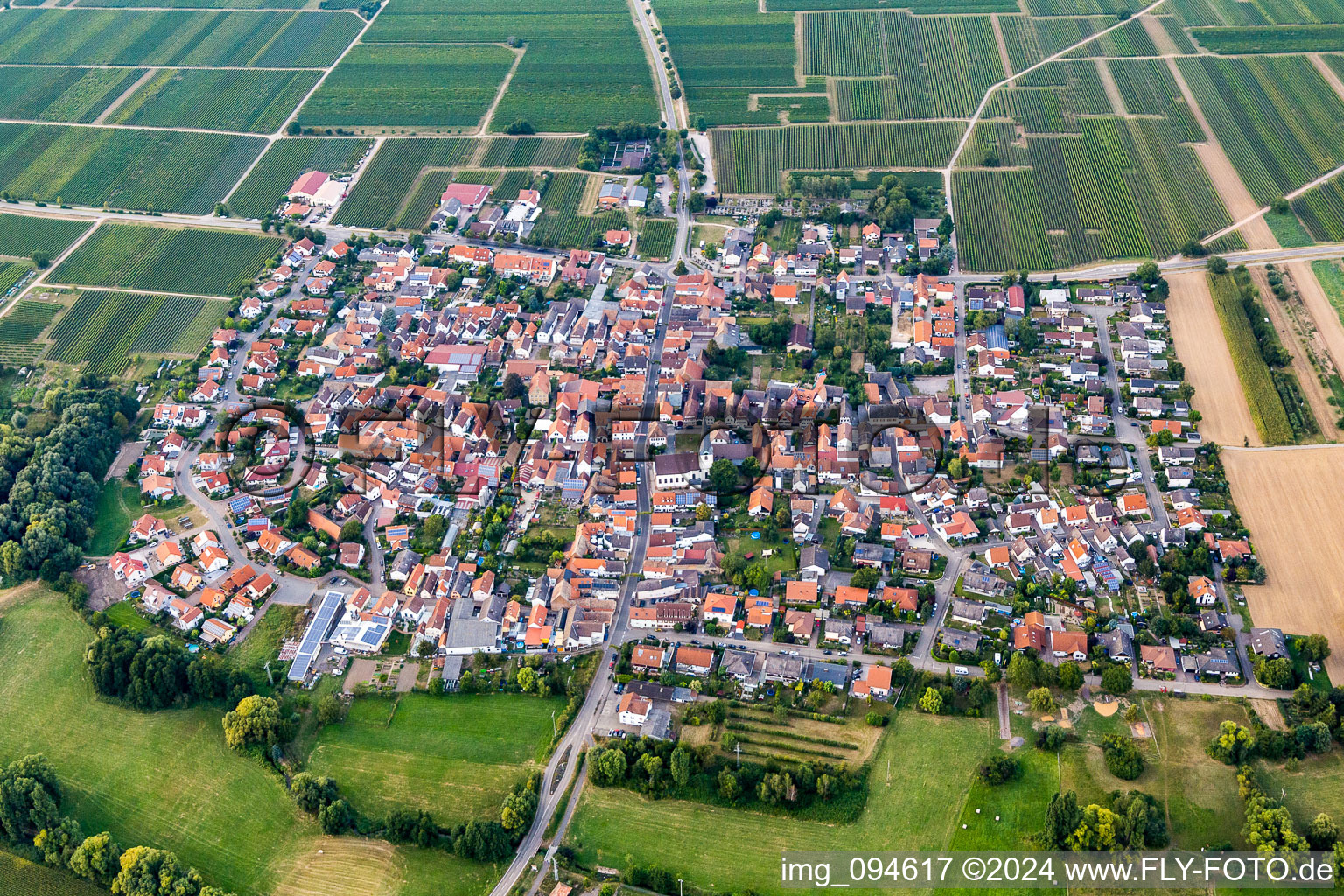 Village - view on the edge of agricultural fields and farmland in Venningen in the state Rhineland-Palatinate, Germany out of the air