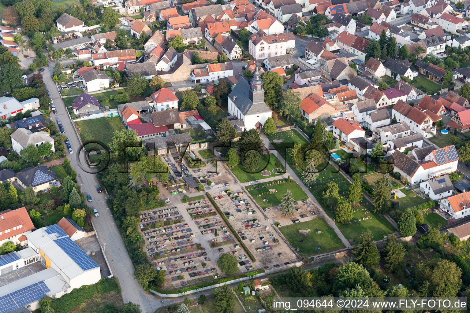 Grave rows on the grounds of the cemetery near the church in Gross-Rohrheim in the state Hesse, Germany