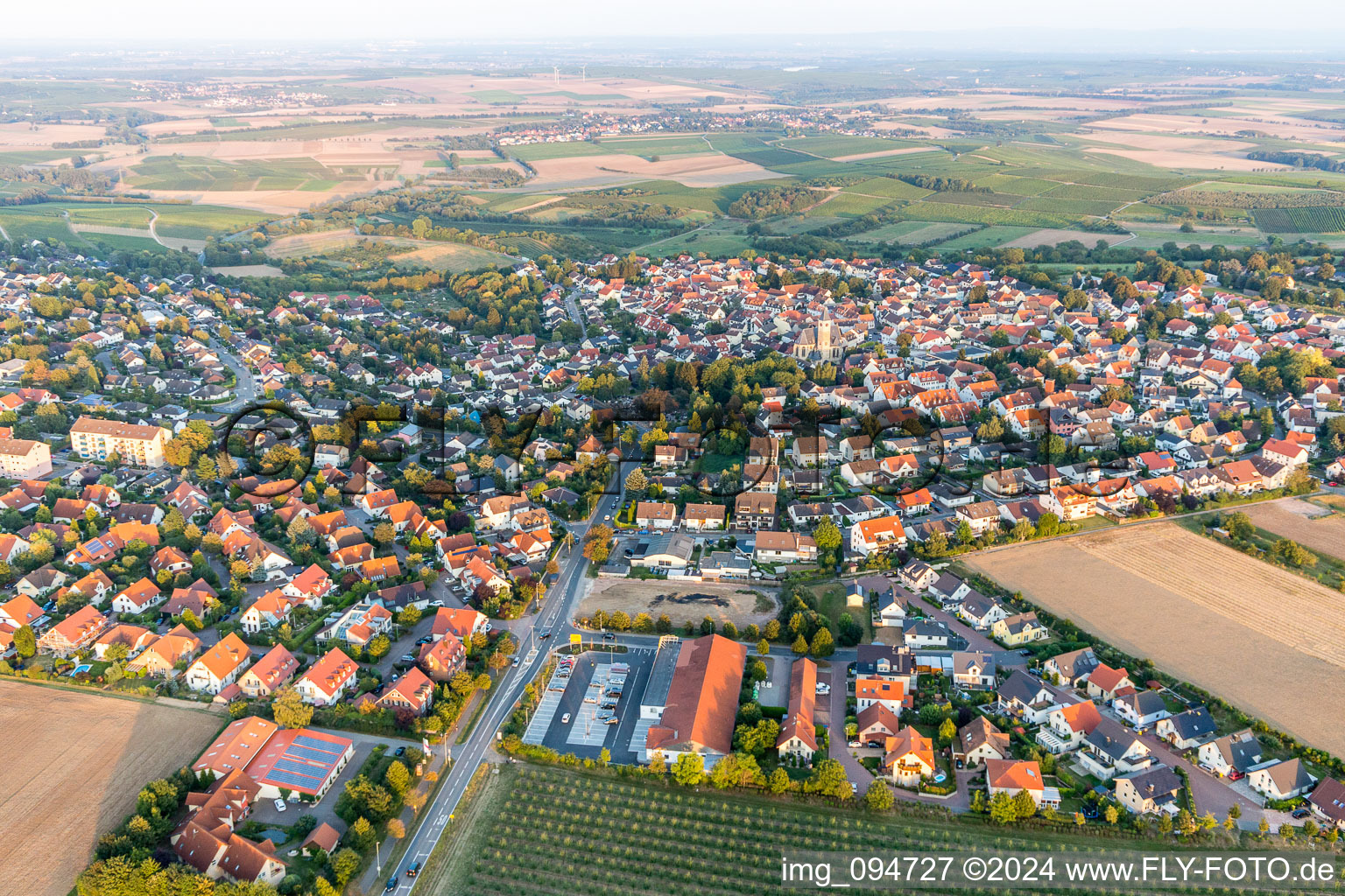 Village - view on the edge of agricultural fields and farmland in Zornheim in the state Rhineland-Palatinate, Germany