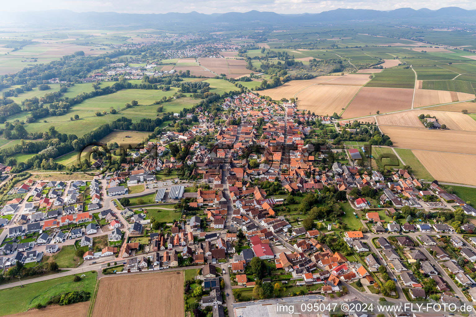 Oblique view of Village - view on the edge of agricultural fields and farmland in Rohrbach in the state Rhineland-Palatinate, Germany