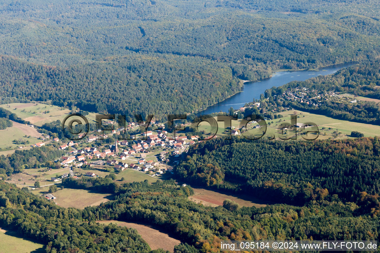 Aerial photograpy of Village on the lake bank areas of Etang de Haspelschiedt in Haspelschiedt in Grand Est, France