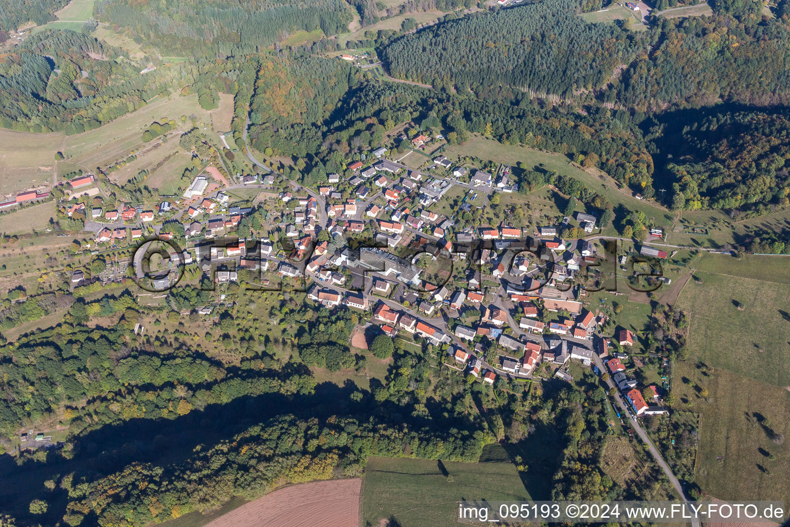 Village - view on the edge of agricultural fields and farmland in Schweix in the state Rhineland-Palatinate, Germany