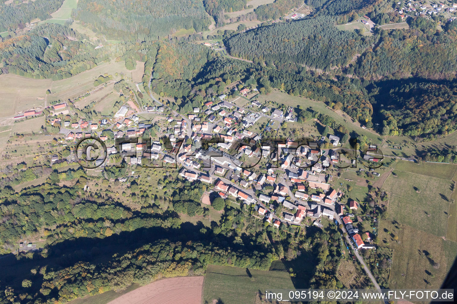 Aerial view of Village - view on the edge of agricultural fields and farmland in Schweix in the state Rhineland-Palatinate, Germany