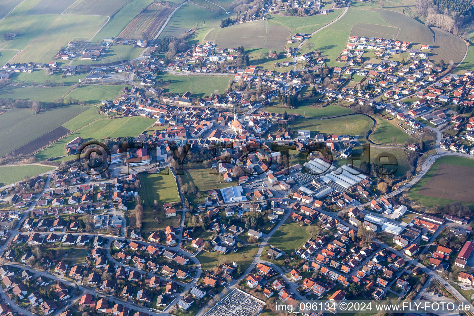 Village - view on the edge of agricultural fields and farmland in Triftern in the state Bavaria, Germany