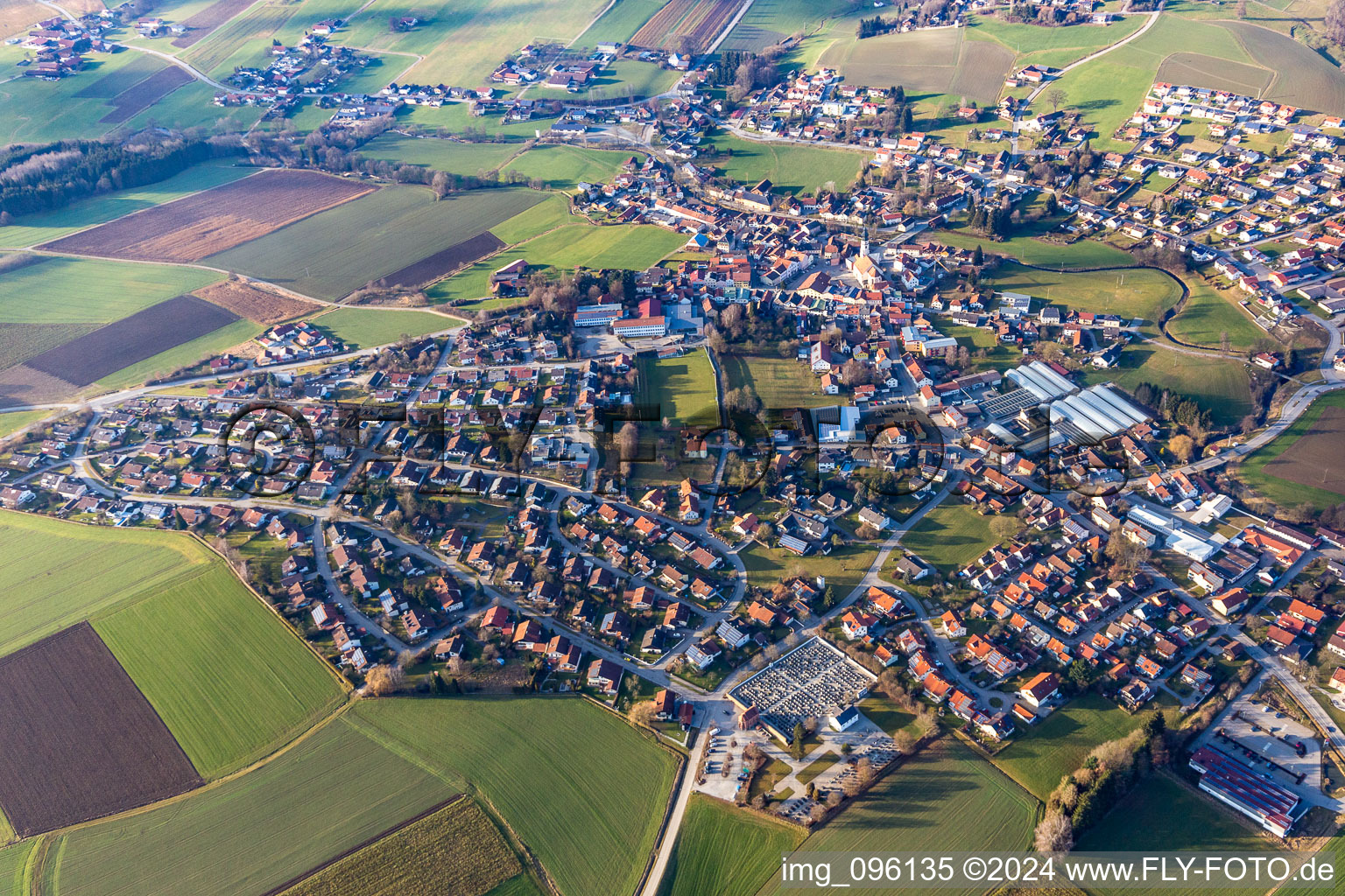 Aerial view of Village - view on the edge of agricultural fields and farmland in Triftern in the state Bavaria, Germany