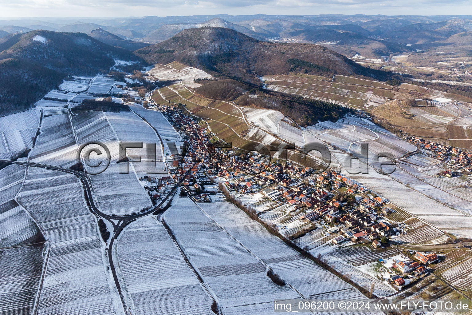 Wintry snowy Village - view on the edge of snowed wine yards in Ranschbach in the state Rhineland-Palatinate, Germany