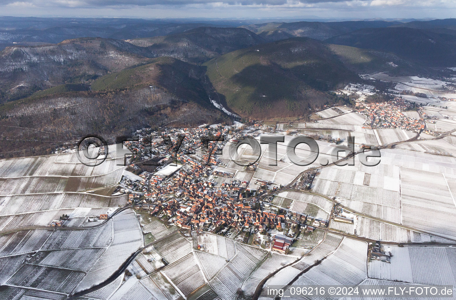 Wintry snowy Village - view on the edge of wine yards in Frankweiler in the state Rhineland-Palatinate, Germany