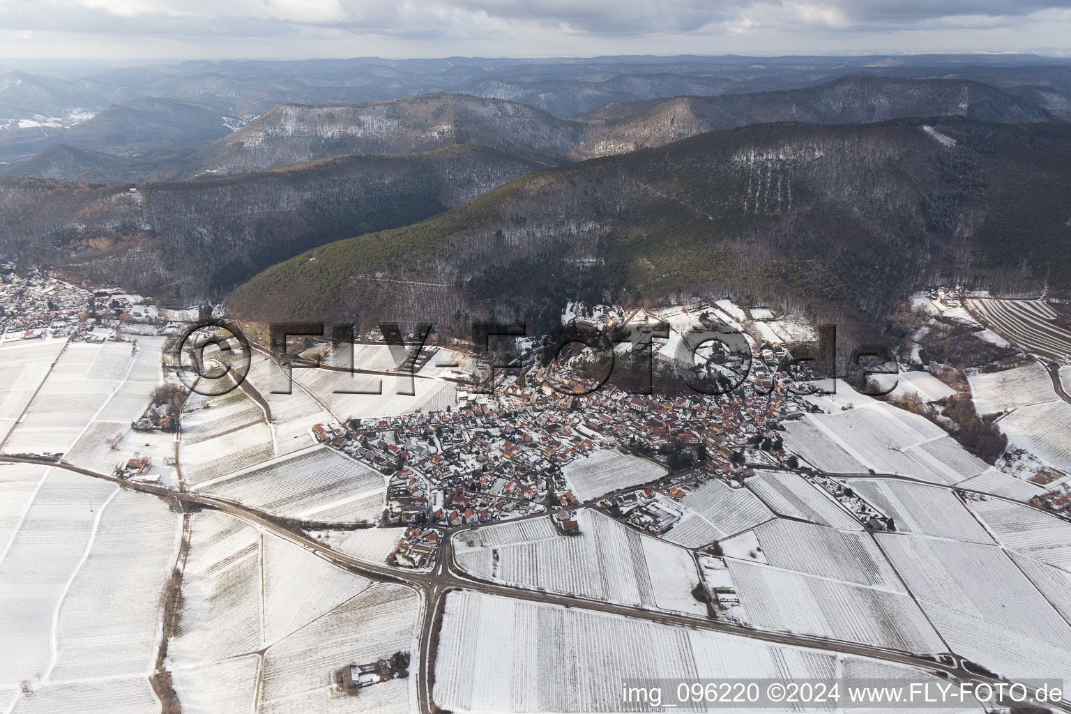 Wintry snowy Village - view on the edge of agricultural fields and farmland in Gleisweiler in the state Rhineland-Palatinate, Germany