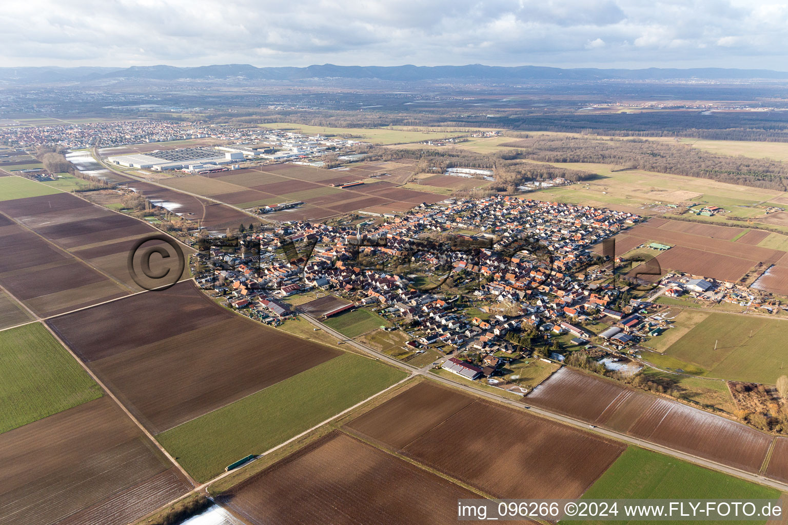 Village - view on the edge of agricultural fields and farmland in Ottersheim bei Landau in the state Rhineland-Palatinate, Germany