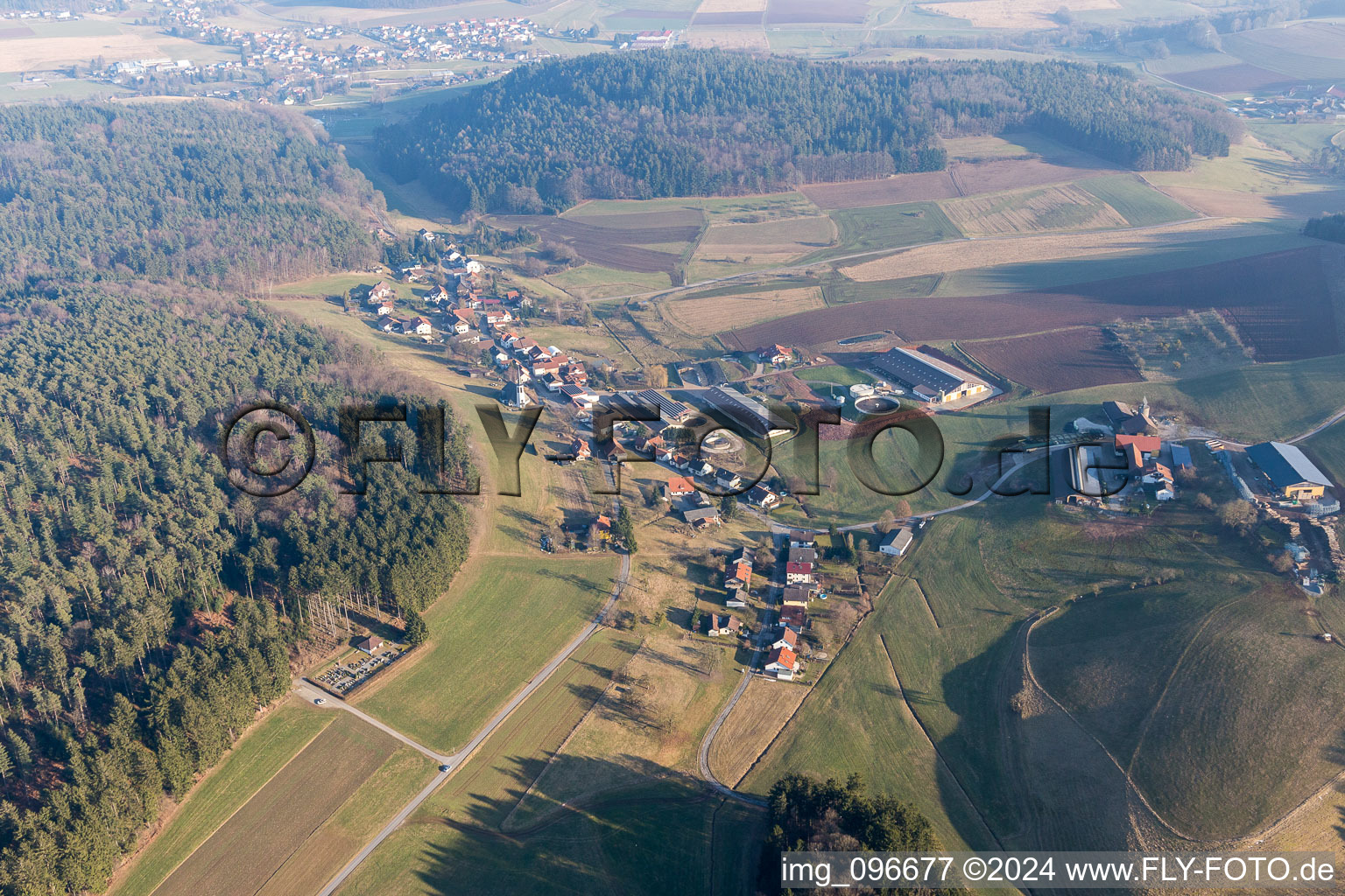 Village - view on the edge of agricultural fields and farmland in Kocherbach in the state Hesse, Germany