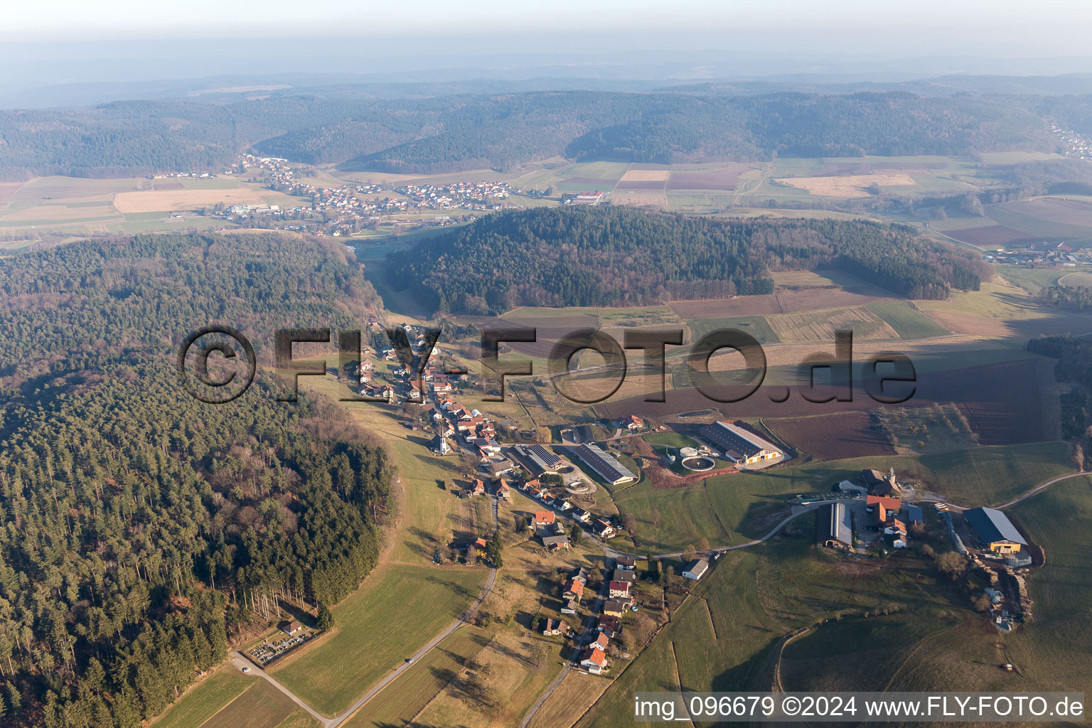 Aerial photograpy of Village - view on the edge of agricultural fields and farmland in Kocherbach in the state Hesse, Germany