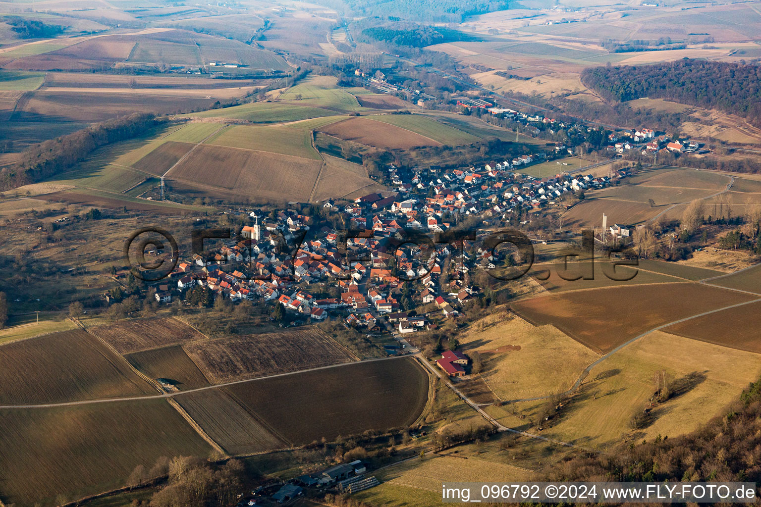 Aerial view of Village - view on the edge of agricultural fields and farmland in Wiebelsbach in the state Hesse, Germany