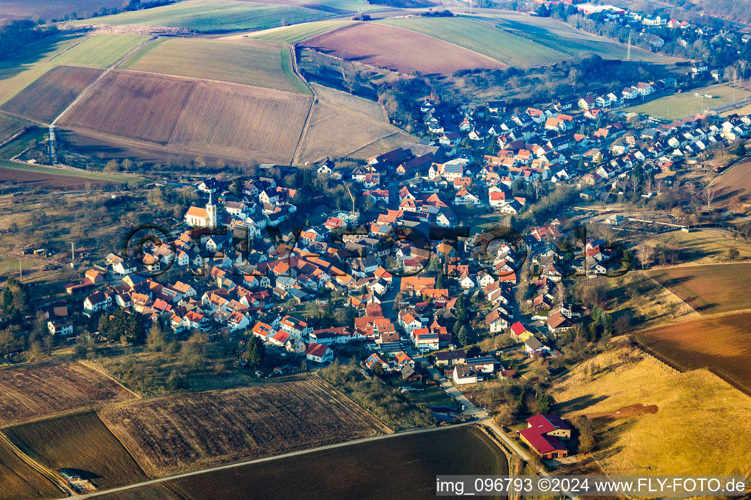 Aerial photograpy of Village - view on the edge of agricultural fields and farmland in Wiebelsbach in the state Hesse, Germany