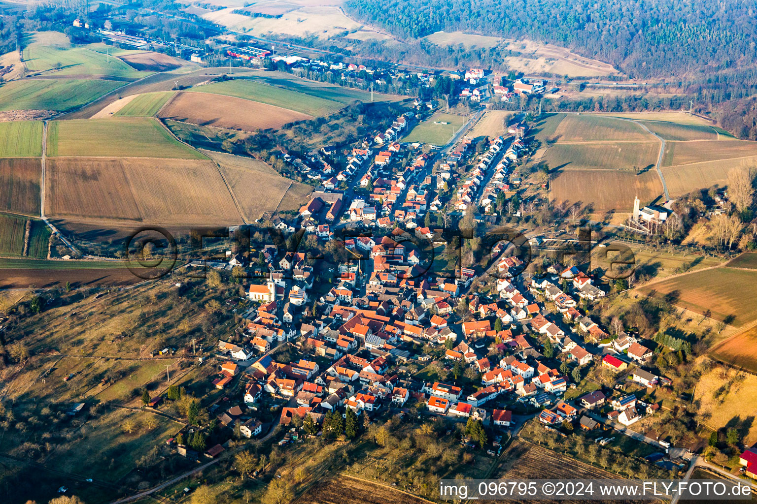 Oblique view of Village - view on the edge of agricultural fields and farmland in Wiebelsbach in the state Hesse, Germany