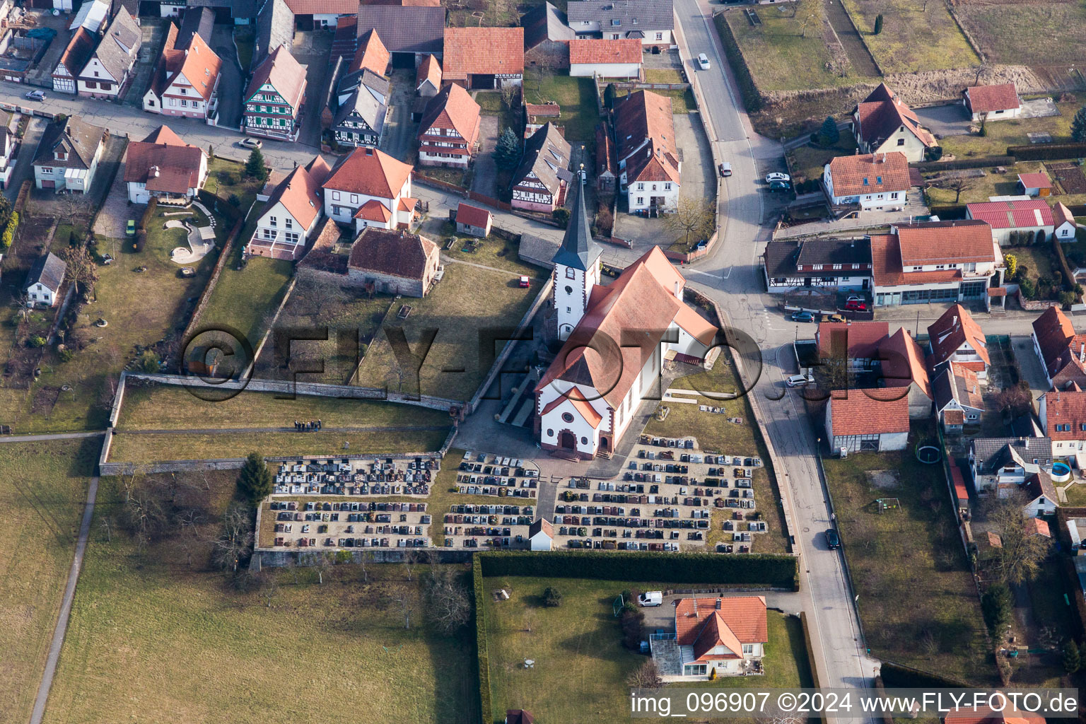 Grave rows on the grounds of the cemetery on the churh catholic Saint-Martin in Seebach in Grand Est, France