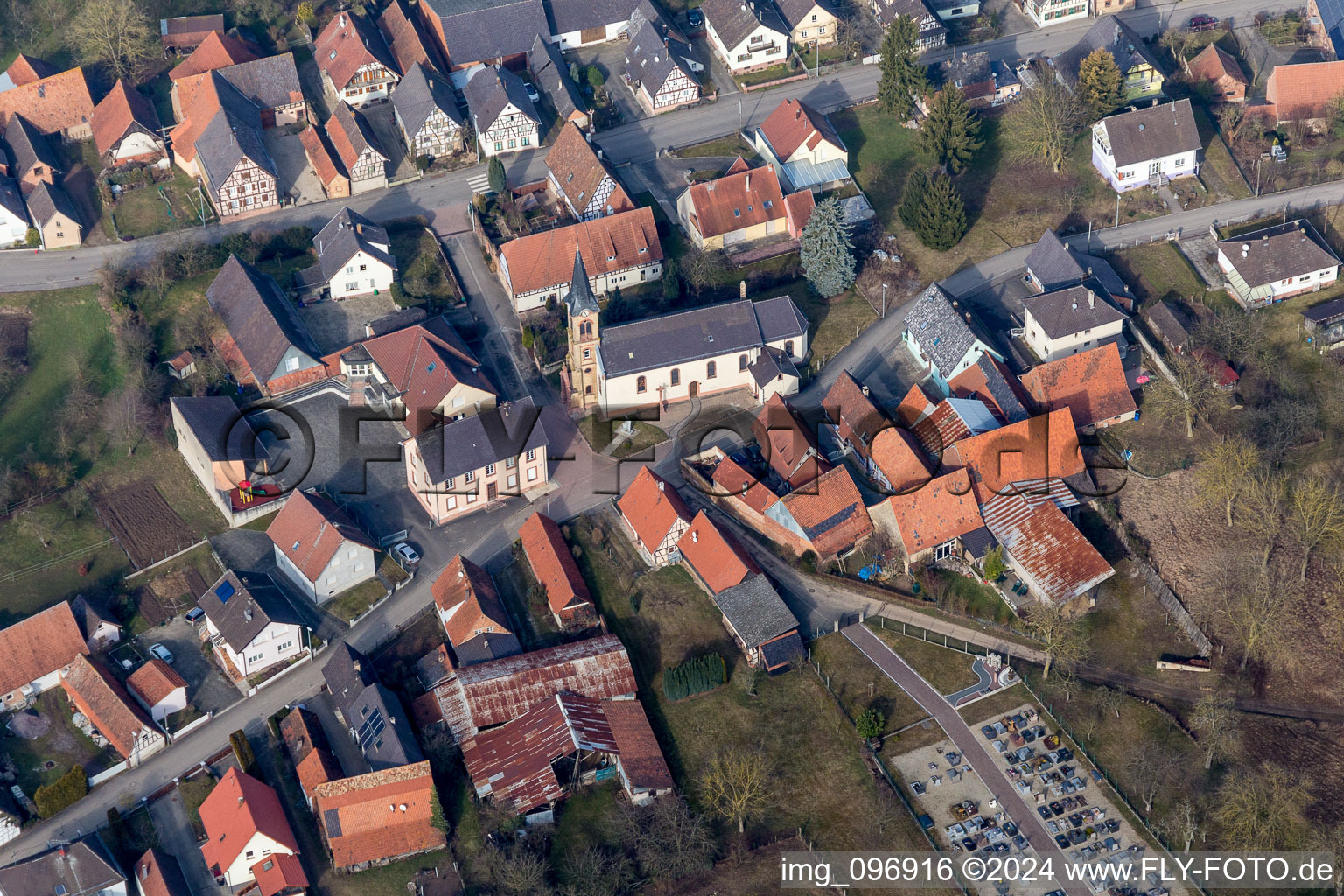 Aerial view of Village - view on the edge of agricultural fields and farmland in Siegen in Grand Est, France