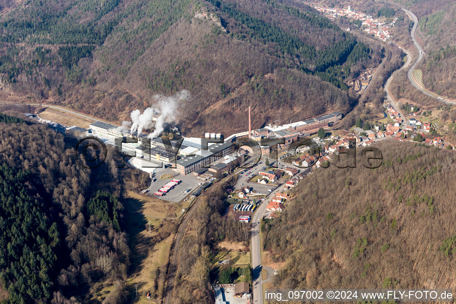 Aerial view of Building and production halls on the premises of Kartonfabrik Buchmann GmbH in the district Sarnstall in Annweiler am Trifels in the state Rhineland-Palatinate, Germany
