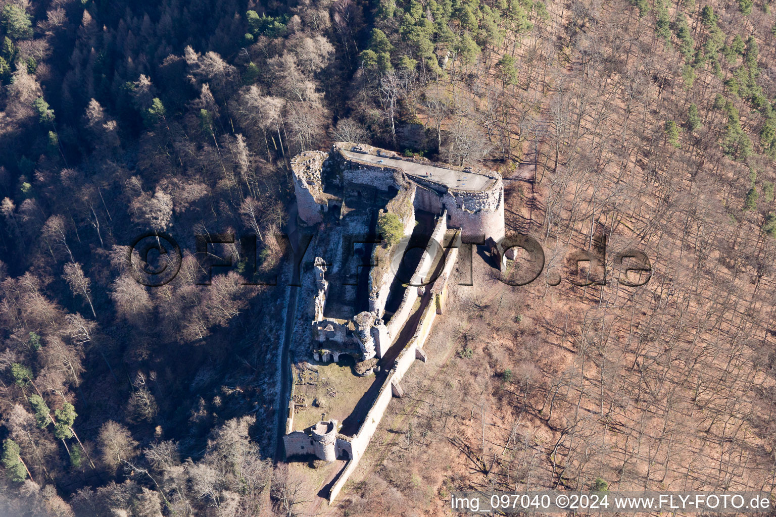 Aerial view of Ruins and vestiges of the former castle and fortress Burg Neuscharfeneck in Ramberg in the state Rhineland-Palatinate