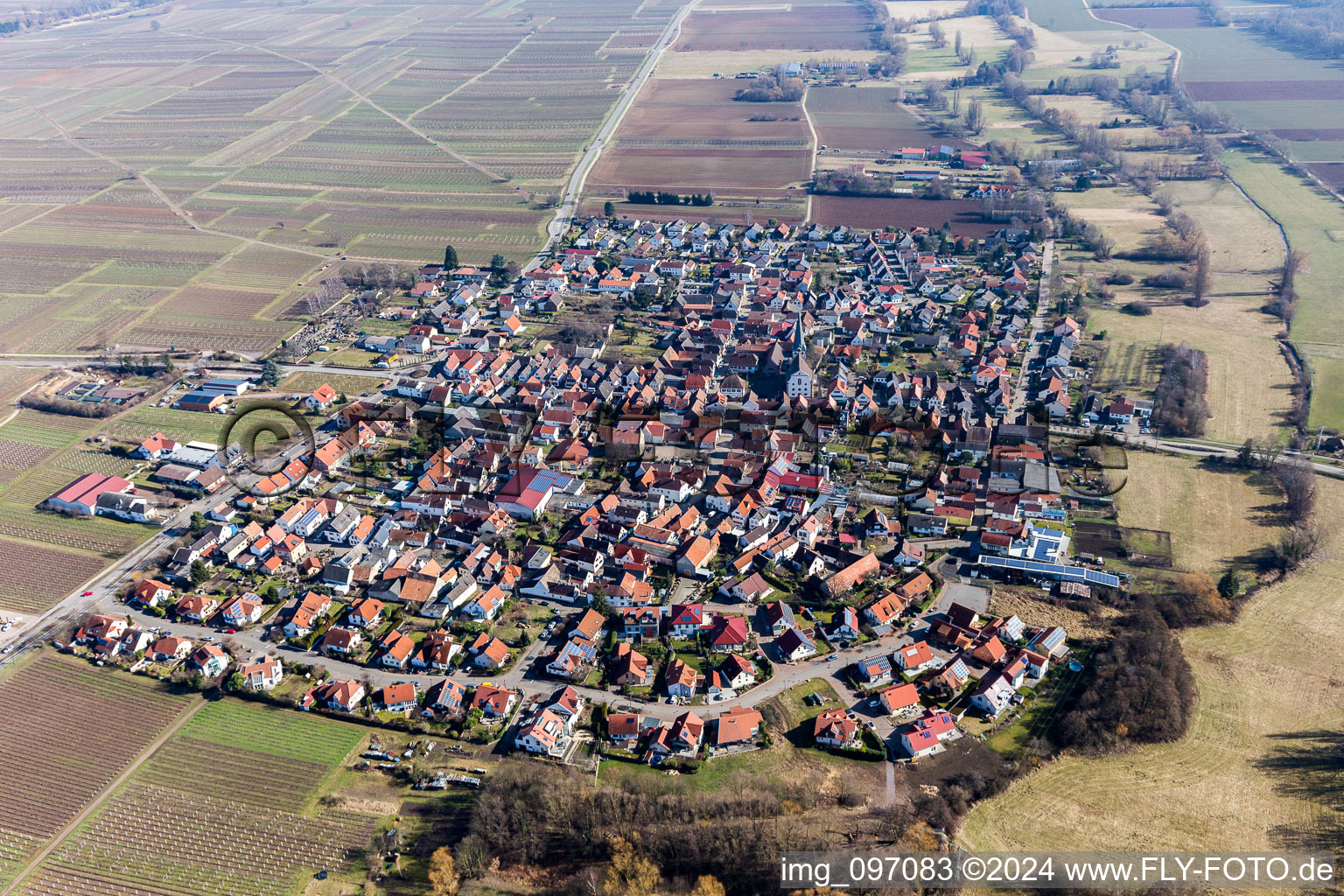 Village - view on the edge of agricultural fields and farmland in Venningen in the state Rhineland-Palatinate, Germany seen from above