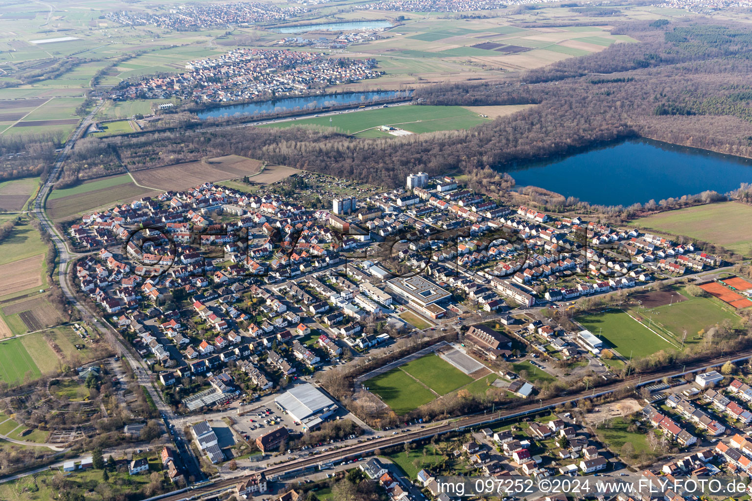 Aerial view of Village on the lake bank areas of Baggersee Untergrombach in Untergrombach in the state Baden-Wurttemberg, Germany