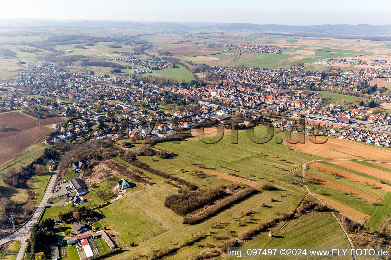 Village - view on the edge of agricultural fields and farmland in Pfaffenhoffen in Grand Est, France