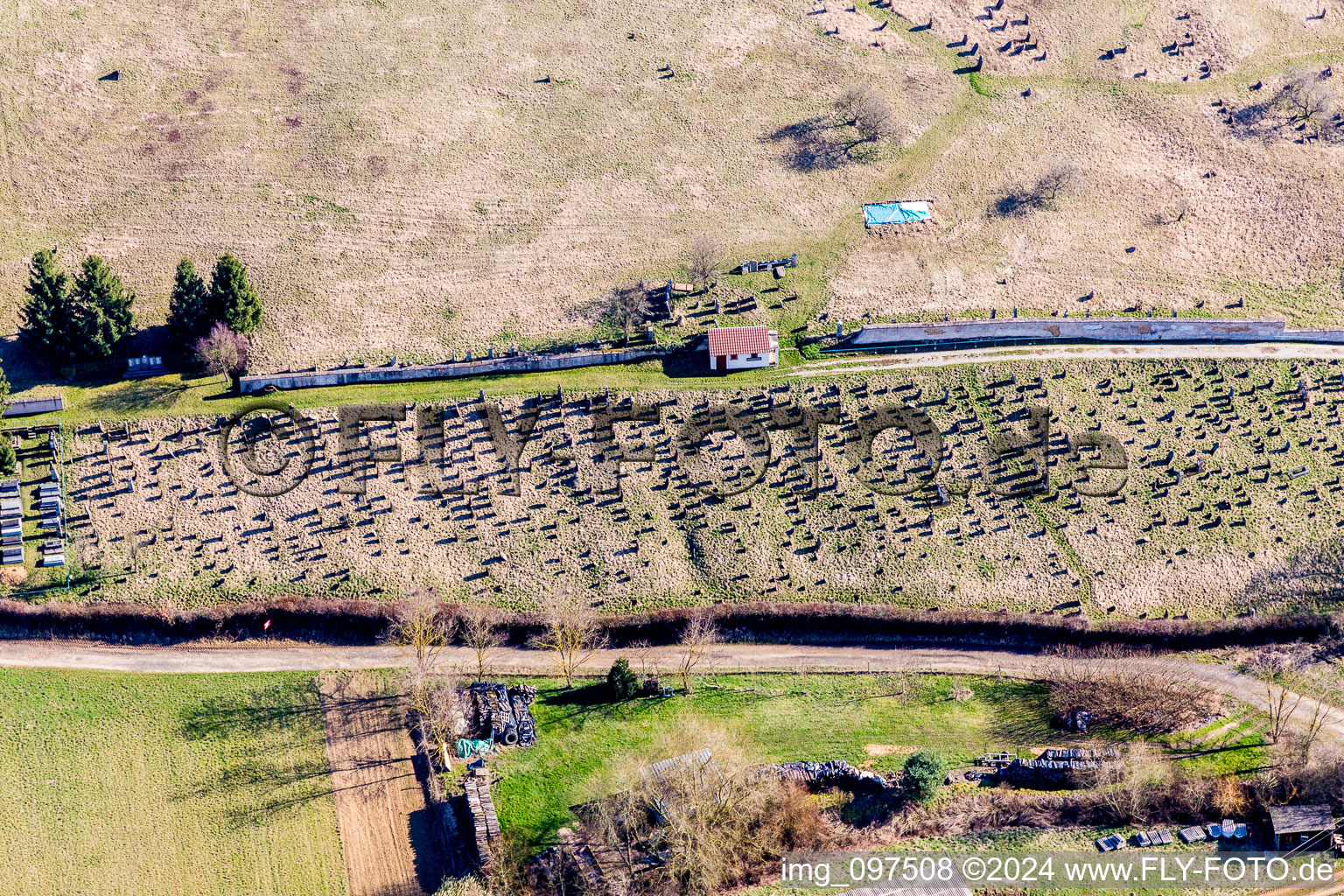 Grave rows on the grounds of the cemetery in Ettendorf in Grand Est, France from above