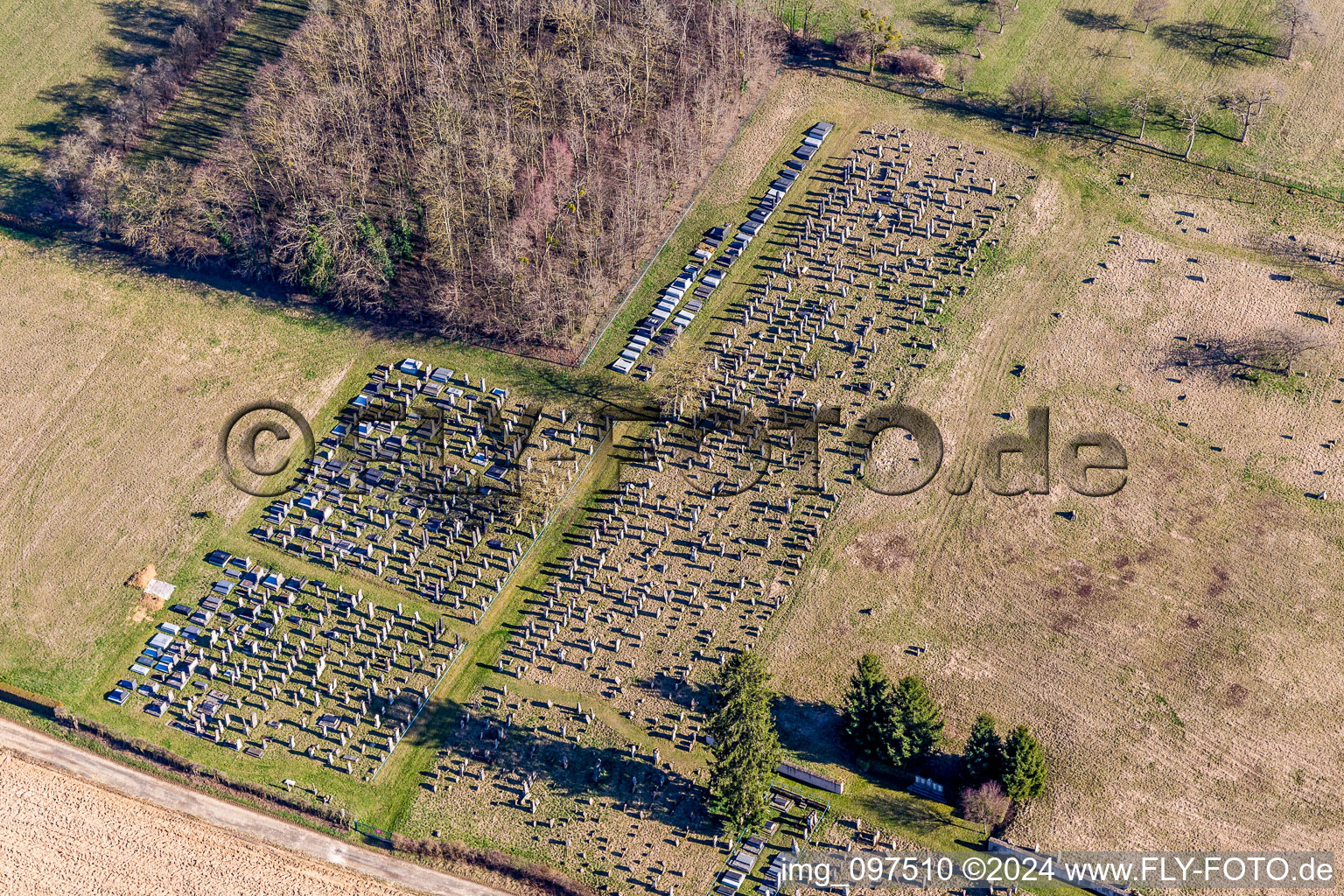 Grave rows on the grounds of the cemetery in Ettendorf in Grand Est, France seen from above