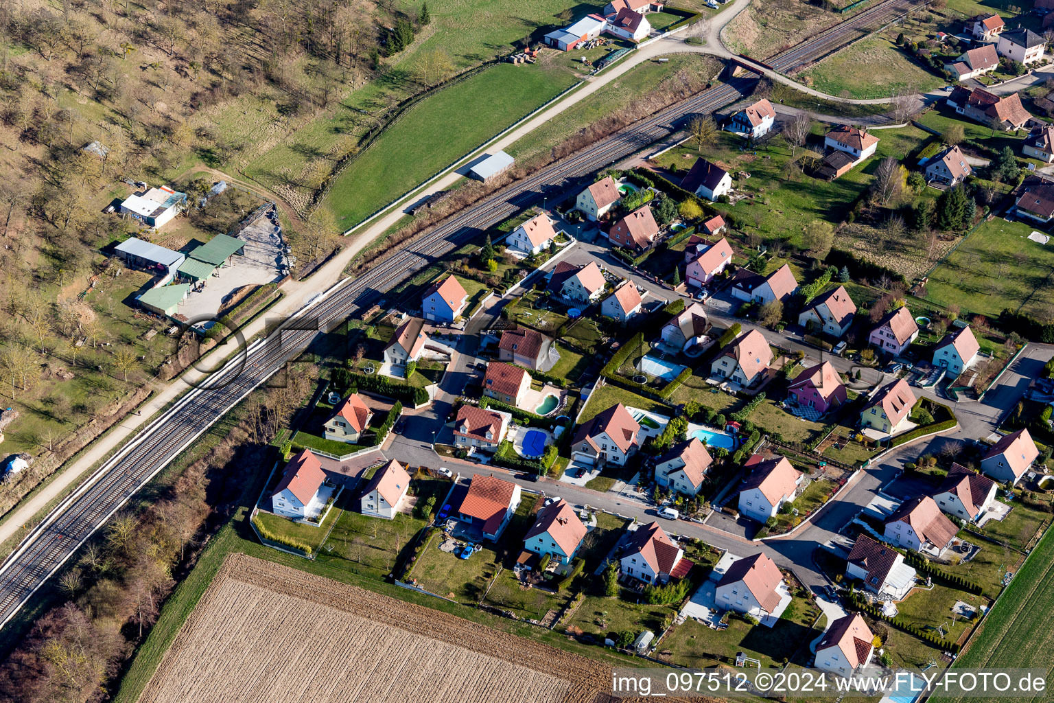 Aerial view of Railway track and overhead wiring harness in the TGV route network of the SNCF in Ettendorf in Grand Est, France