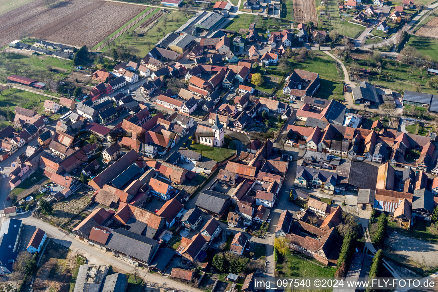 Village - view on the edge of agricultural fields and farmland in Gottesheim in Grand Est, France