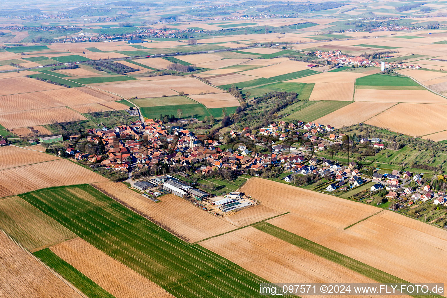 Village - view on the edge of agricultural fields and farmland in Melsheim in Grand Est, France