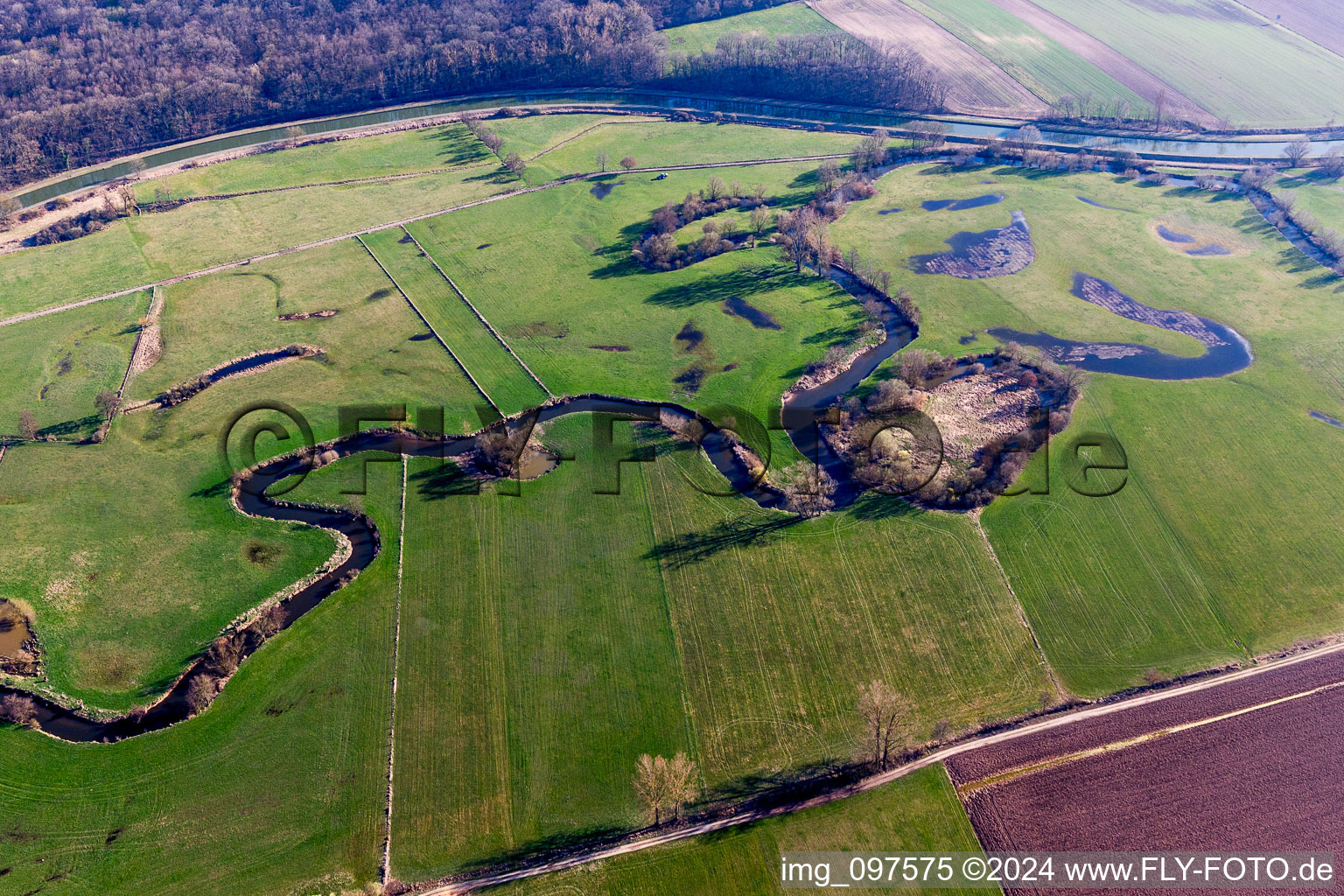 Aerial view of Meandering, serpentine curve of a river Zorn in Hochfelden in Grand Est, France