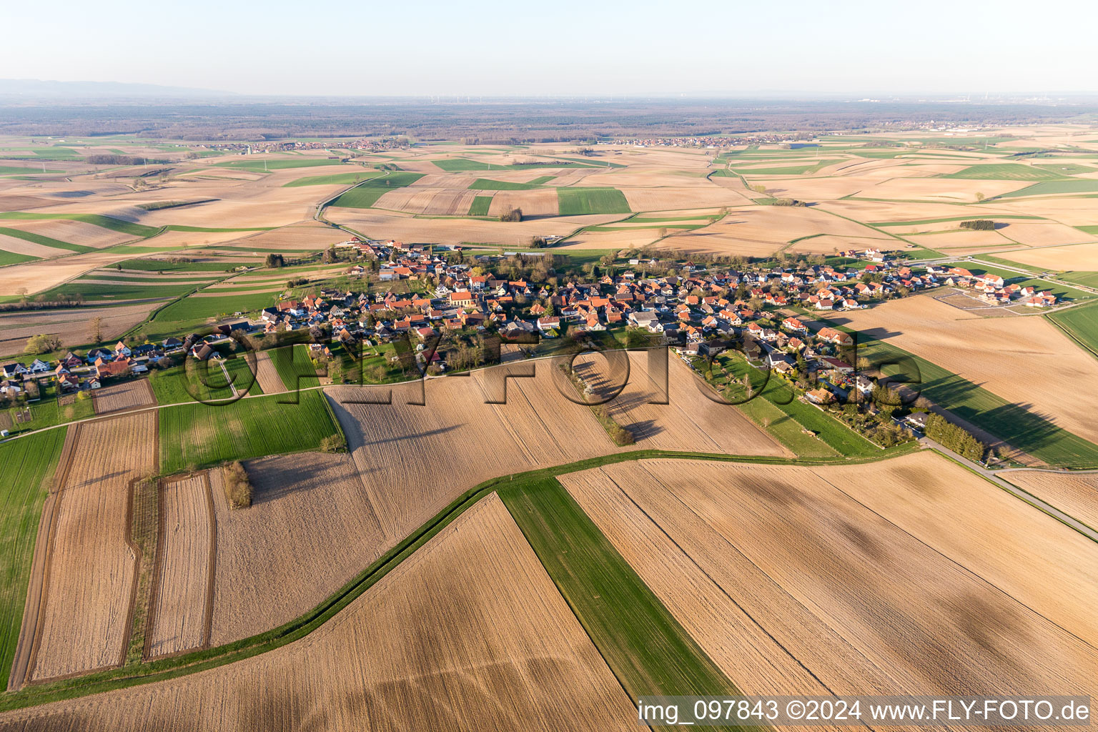 Village - view on the edge of agricultural fields and farmland in Oberlauterbach in Grand Est, France