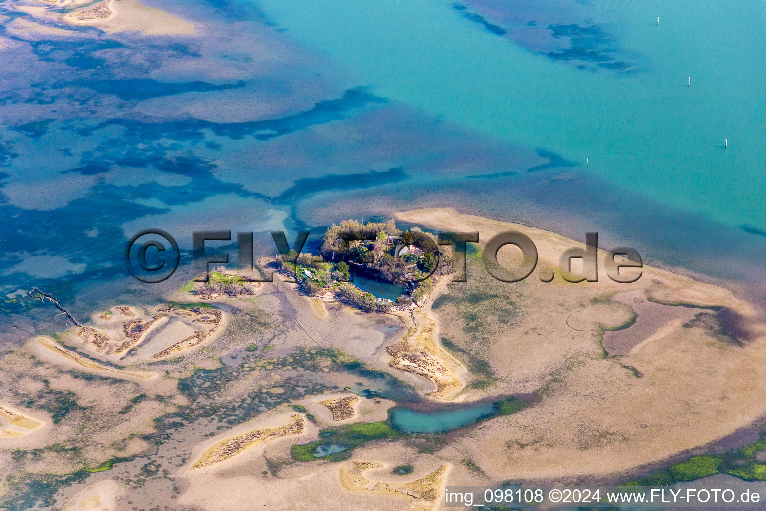 Marsh land, beaches and fishermens hut on the Isola Sant Andrea in the Lido of Grado near Lignano Sabbiadoro in Friuli-Venezia Giulia, Italy