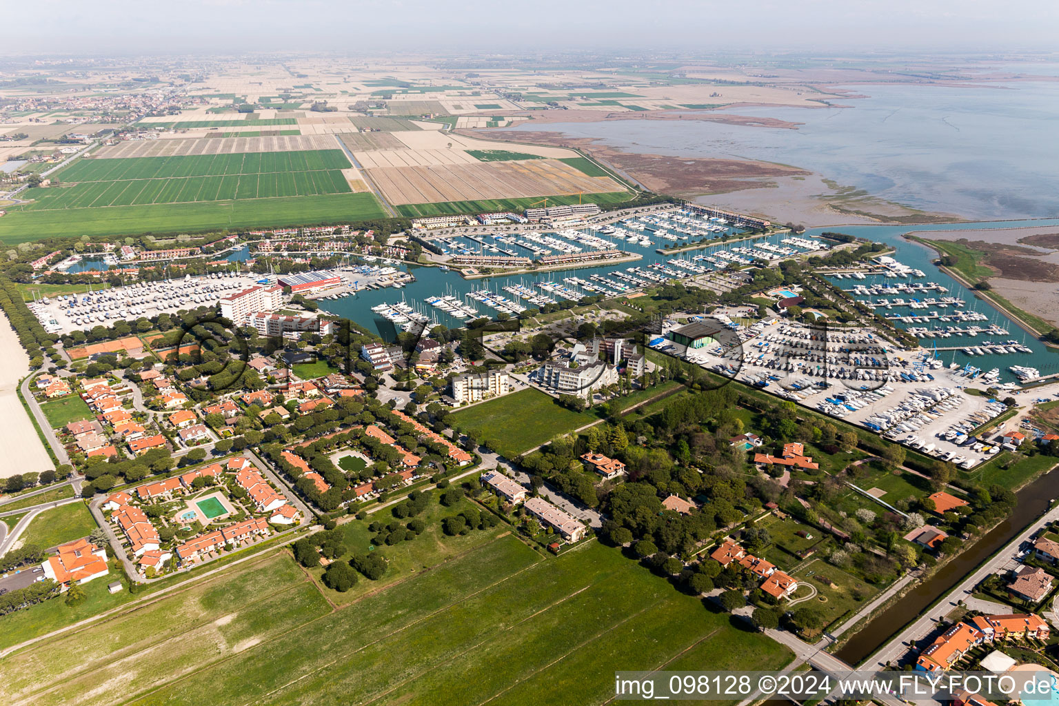 Aerial view of Pleasure boat marina with docks and moorings on the shore area of Marina Punta Gabbiani Aprilia Marittima in the district Aprilia Marittima in Bevazzana in Friuli-Venezia Giulia, Italy