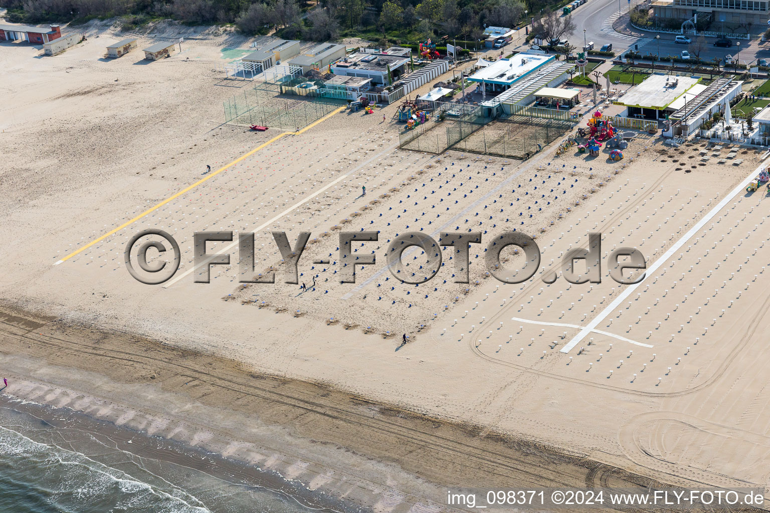 Beach landscape along the adriatic sea with rows of empty beach chairs in the district Pinarella in Cervia in Emilia-Romagna, Italy