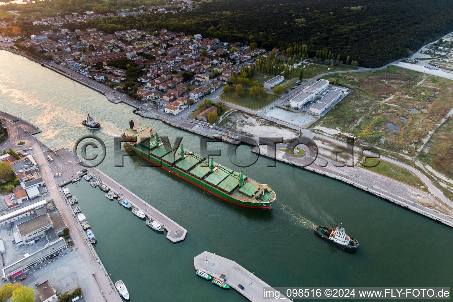 Cargo ships and bulk carriers towed to the Adriatic sea in Marina di Ravenna in Emilia-Romagna, Italy