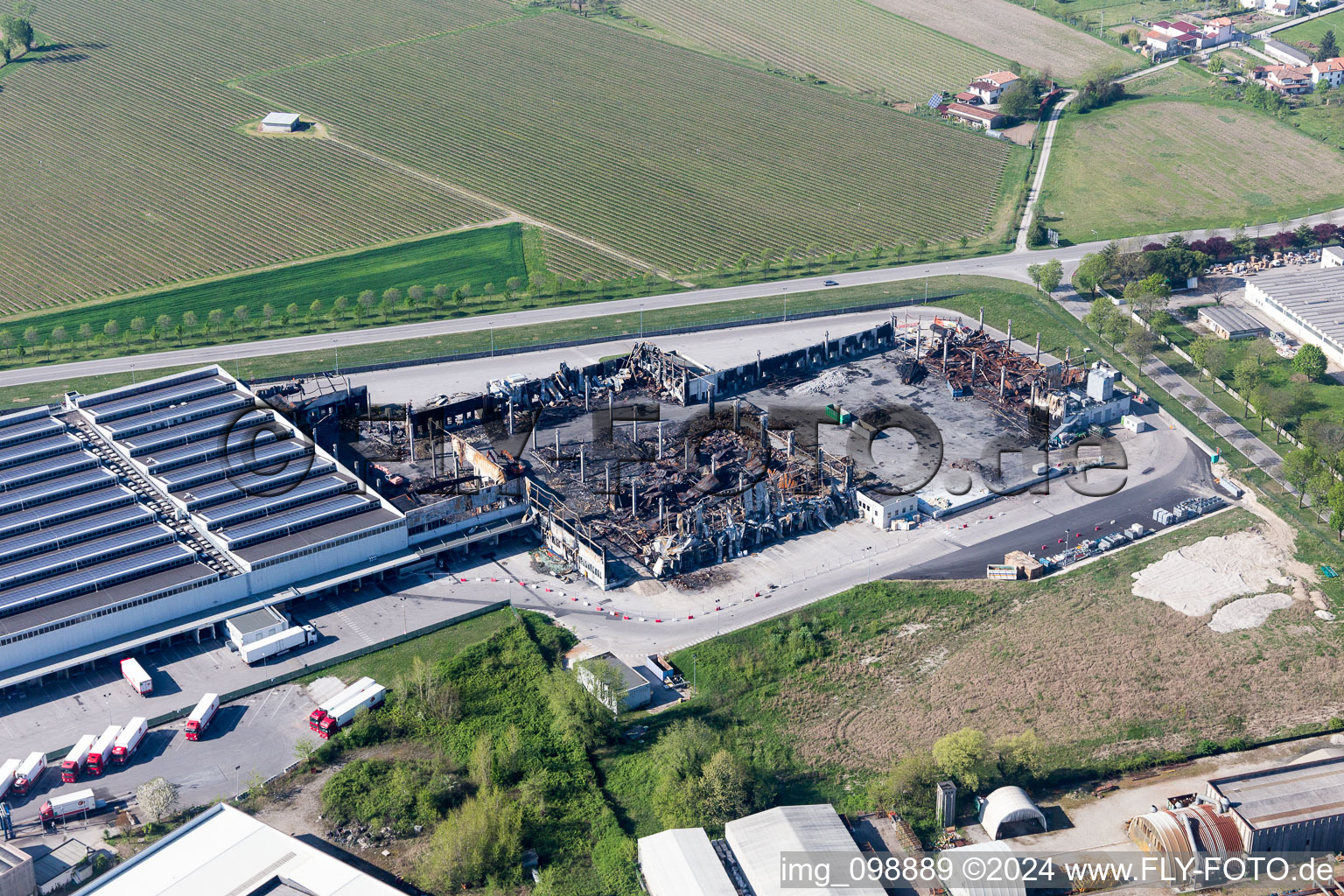 Ruins of the burned down factory - building of the Cooperativa Trasporti Alimentari (R.L.) in Zona Industriale Ponte Rosso in Friuli-Venezia Giulia, Italy