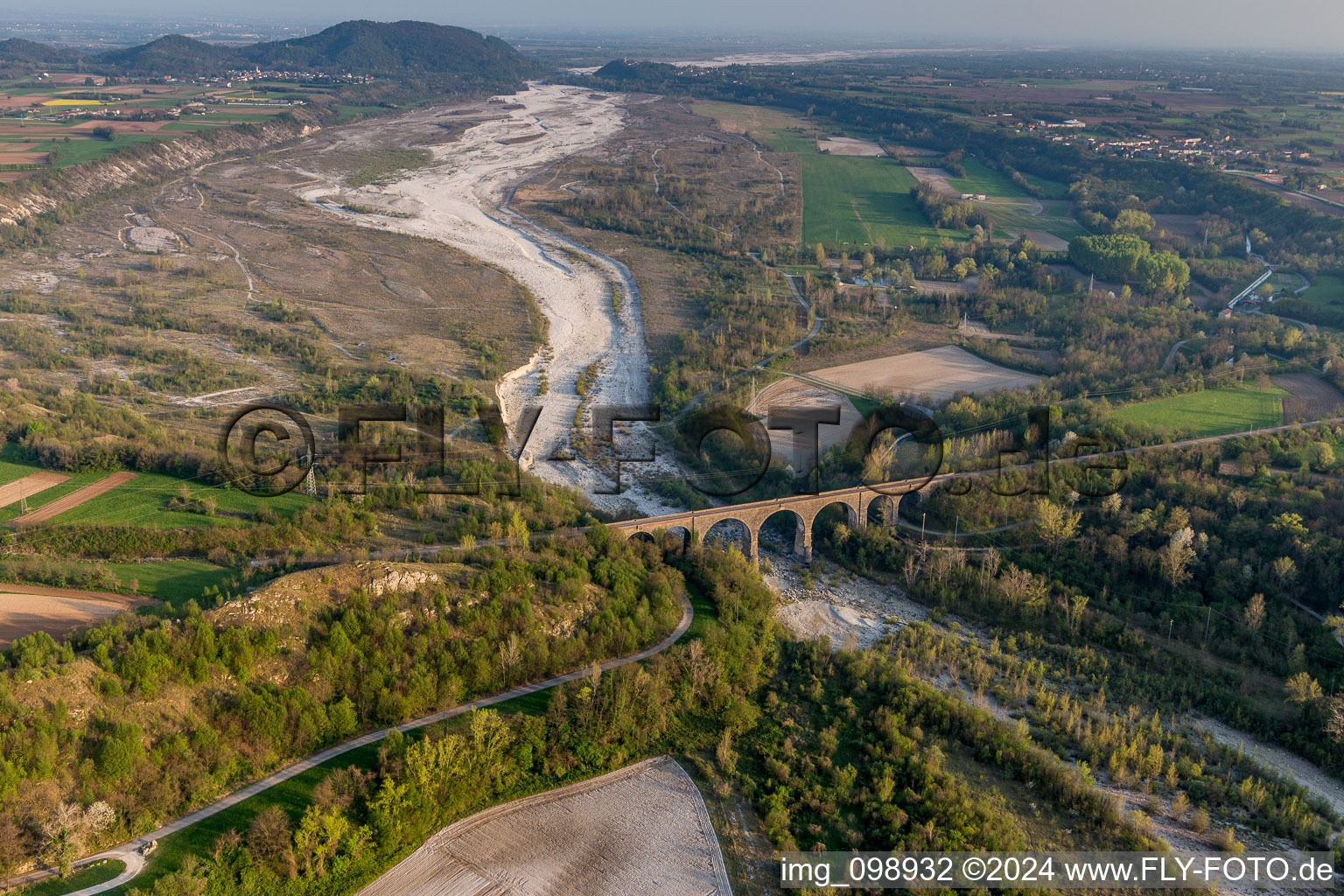 Viaduct of the railway bridge structure to route the railway tracks ver the tagliamento in Cavasso Nuovo in Friuli-Venezia Giulia, Italy out of the air