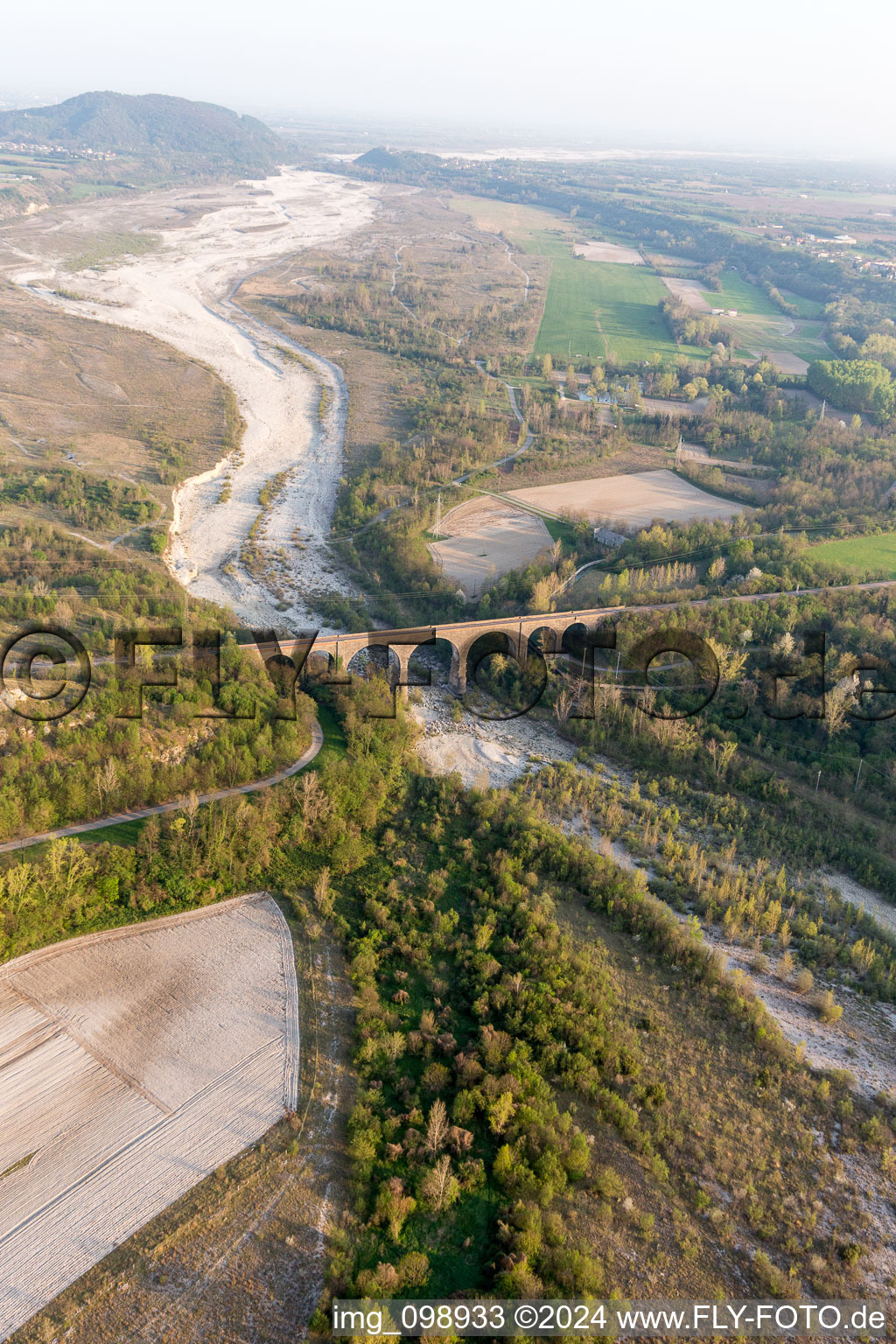 Viaduct of the railway bridge structure to route the railway tracks ver the tagliamento in Cavasso Nuovo in Friuli-Venezia Giulia, Italy seen from above