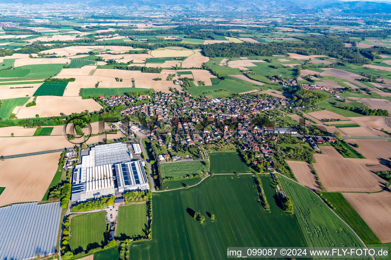 Village - view on the edge of agricultural fields and farmland in Scherzheim in the state Baden-Wurttemberg, Germany