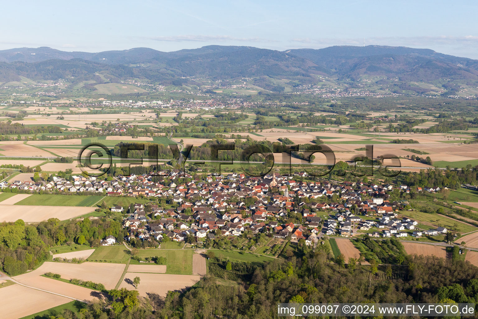 Village - view on the edge of agricultural fields and farmland in Unzhurst in the state Baden-Wurttemberg, Germany