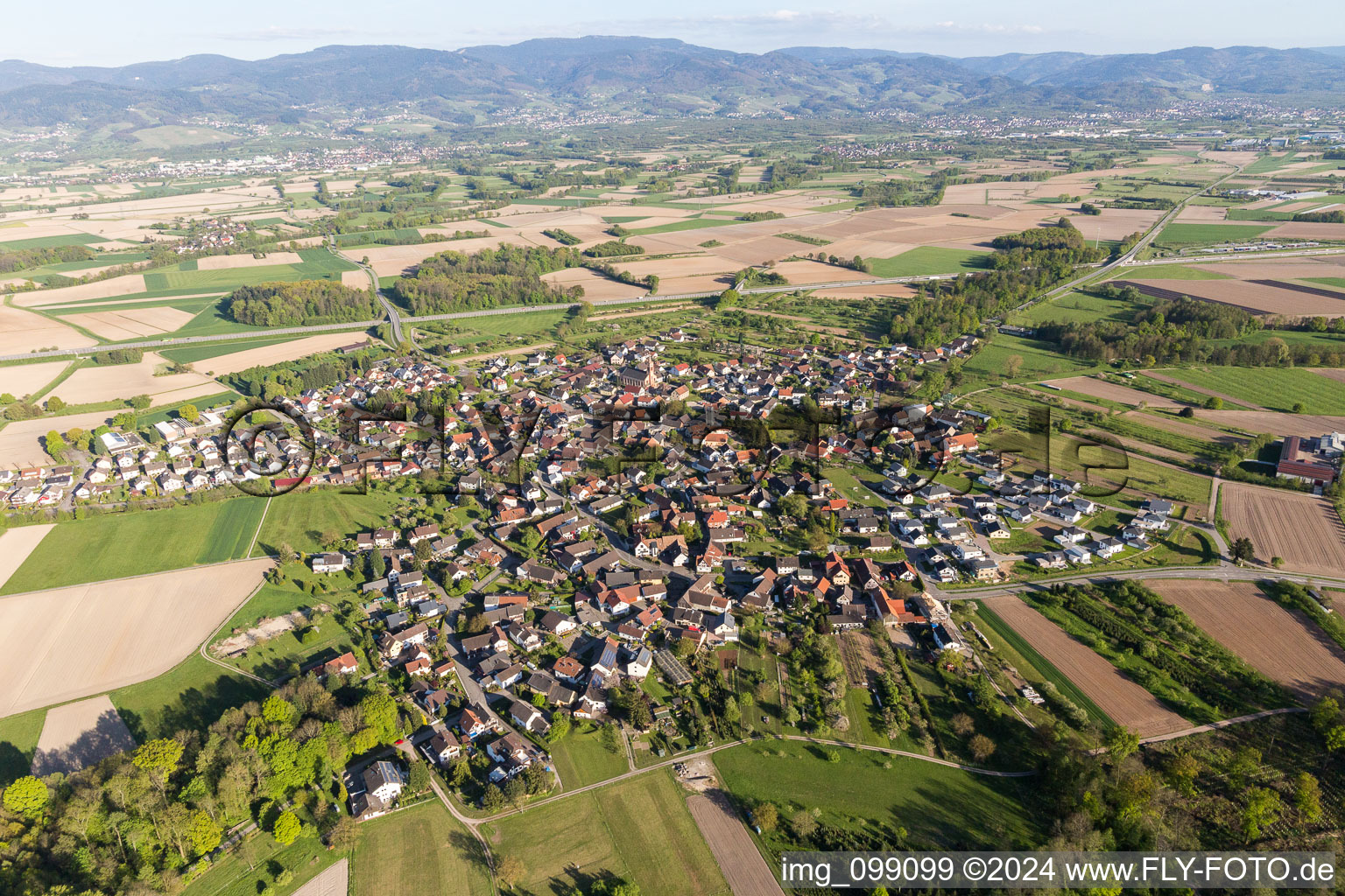 Aerial view of Village - view on the edge of agricultural fields and farmland in Unzhurst in the state Baden-Wurttemberg, Germany