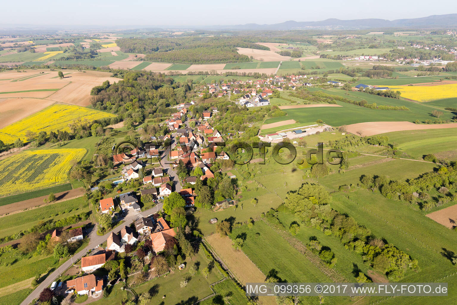 Village - view on the edge of agricultural fields and farmland in Gunstett in Grand Est, France