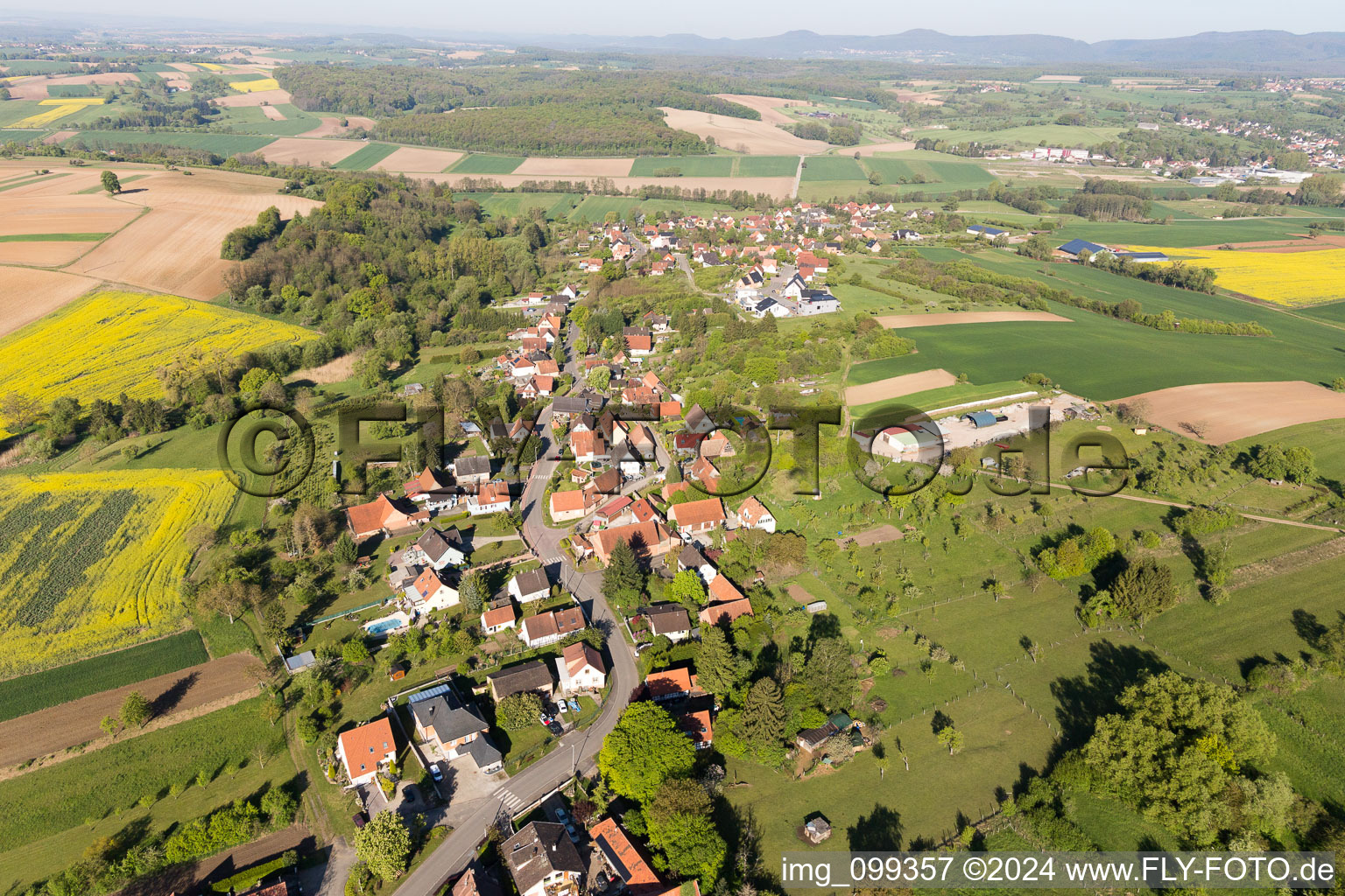 Aerial view of Village - view on the edge of agricultural fields and farmland in Gunstett in Grand Est, France