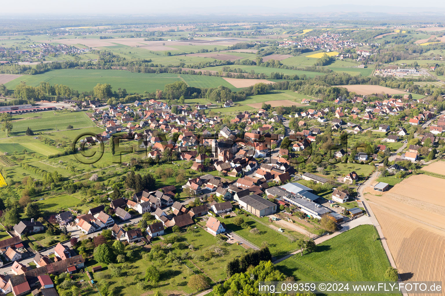 Aerial view of Village - view on the edge of agricultural fields and farmland in Gunstett in Grand Est, France