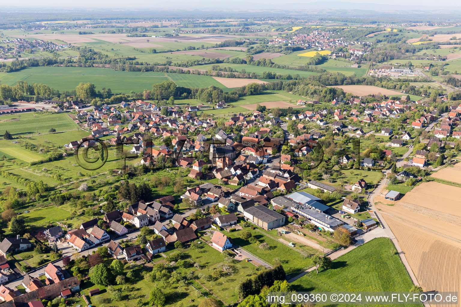 Aerial photograpy of Village - view on the edge of agricultural fields and farmland in Gunstett in Grand Est, France