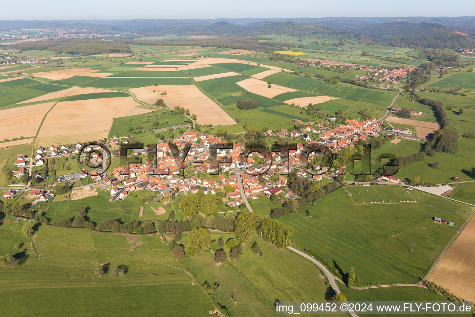 Village - view on the edge of agricultural fields and farmland in Mulhausen in Grand Est, France