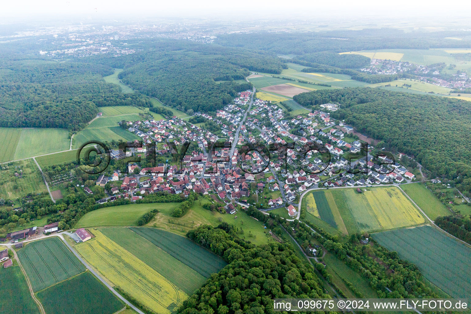 Village - view on the edge of agricultural fields and farmland in Uechtelhausen in the state Bavaria, Germany