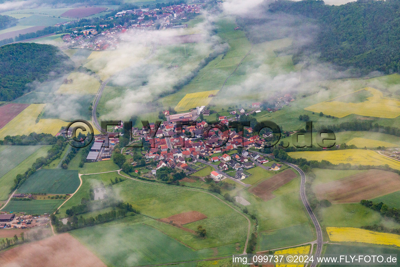 Village under clouds in the district Wustviel in Rauhenebrach in the state Bavaria, Germany