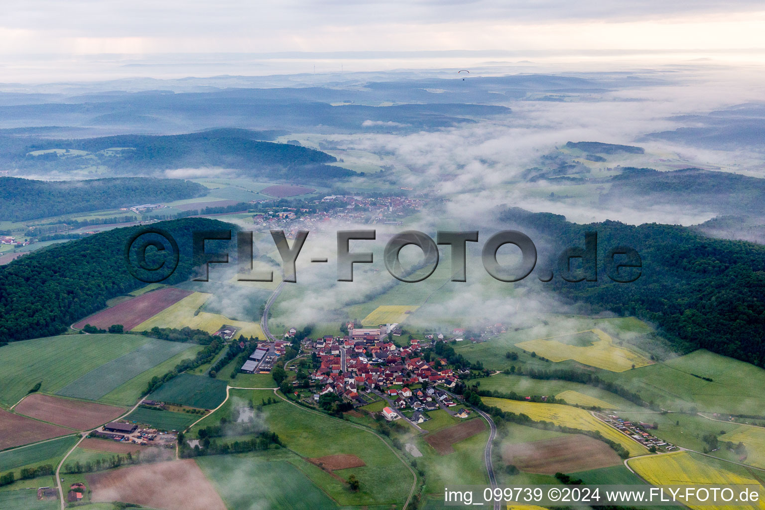 Forest and mountain scenery of Steigerwald in Fruehnebel in Wustviel in the state Bavaria, Germany